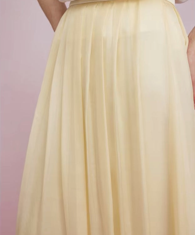 Apricot White skirt at hip level, focusing on the layered fabric effect. From Borcelleclothes.