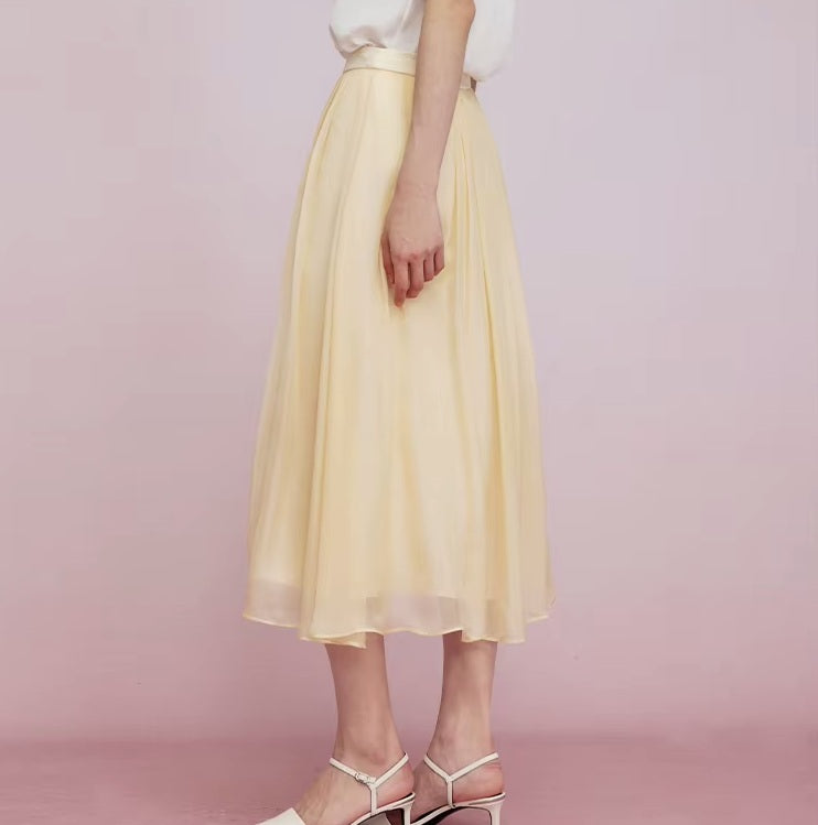Side view of model in Apricot White skirt, emphasizing airy silhouette. From Borcelleclothes.