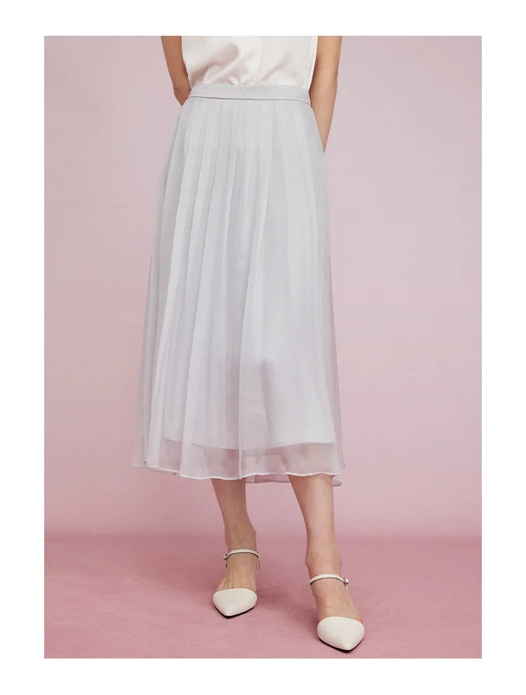 Model stepping forward in Lavender Grey skirt, capturing movement and lightness. From Borcelleclothes.