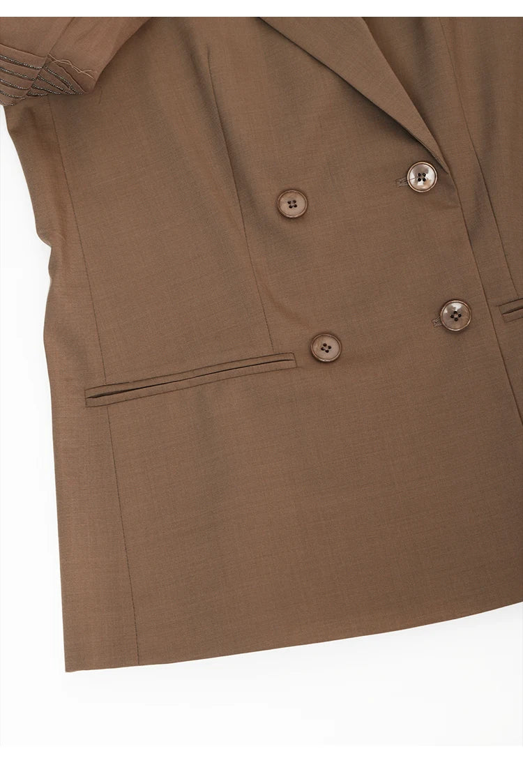 Bottom part of women’s sheer-sleeved wool blazer in Milk Chocolate. From Borcelleclothes.