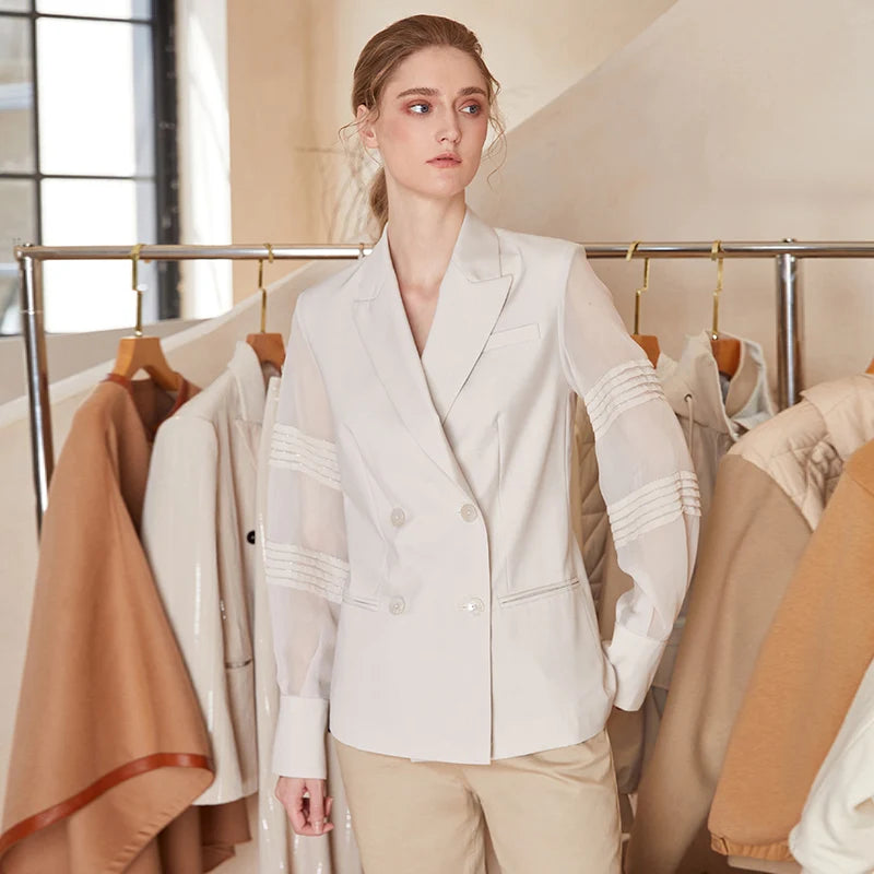 Women’s sheer-sleeved wool blazer in White Coffee, model looking to the side. From Borcelleclothes.