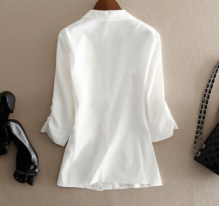 Back view of the Romance blazer — flowing silk structure offering coverage without weight. From Borcelleclothes.