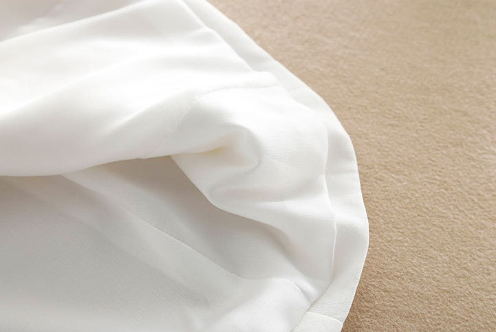 Inner lining of the Romance blazer, subtly folded — refined finishing in breathable silk crepe de chine. From Borcelleclothes.