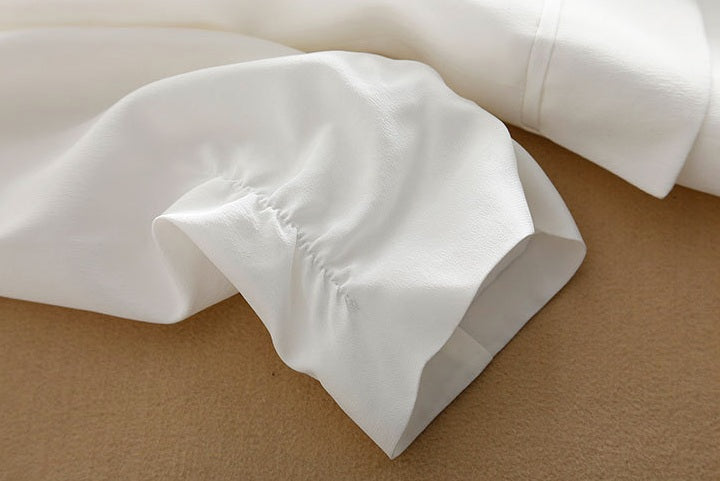 Softly gathered 3/4 sleeve on the Romance silk blazer — a gentle touch that adds movement and ease. From Borcelleclothes.