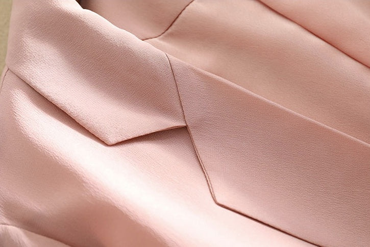 Detail of the lapel on the Rose Fog silk blazer — soft color meeting clean tailoring in a balanced line. From Borcelleclothes.