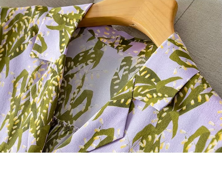 Pastel floral silk crepe de chine shirt on hanger, showing upper part with collar. From Borcelleclothes.