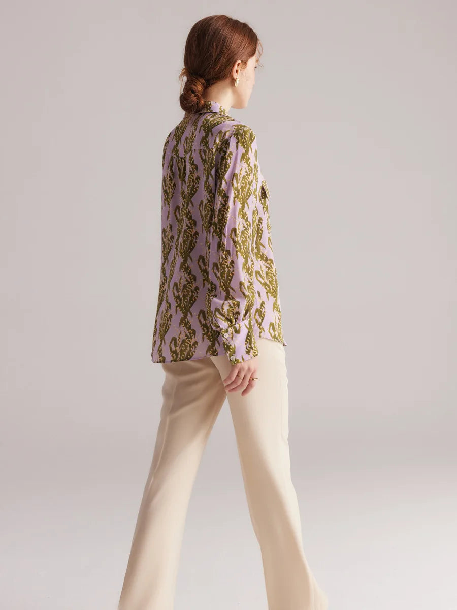 Back view of model wearing pastel floral silk crepe de chine shirt. From Borcelleclothes.