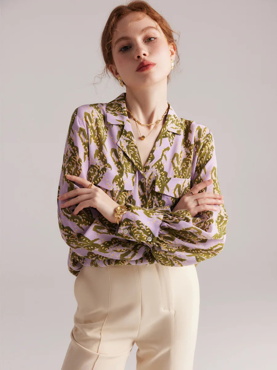 Model in pastel floral silk shirt with arms crossed, showing relaxed fit. From Borcelleclothes.
