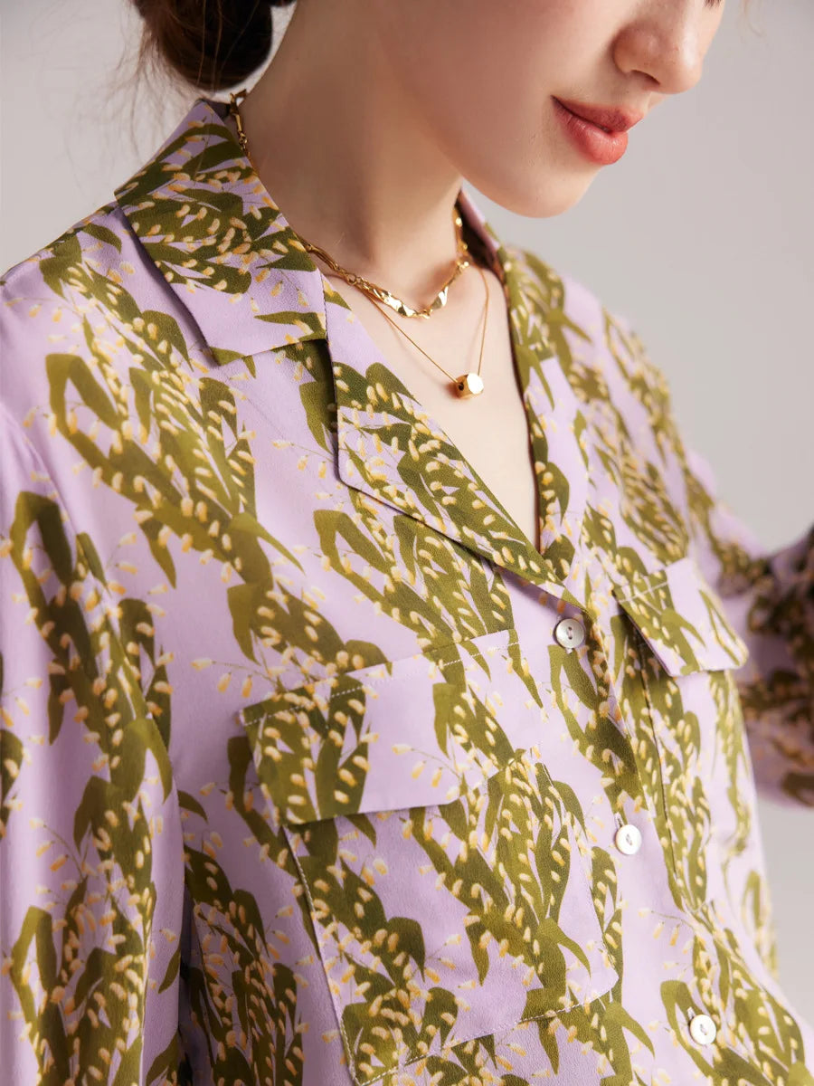 Model wearing pastel floral silk shirt, upper part with notched collar. From Borcelleclothes.