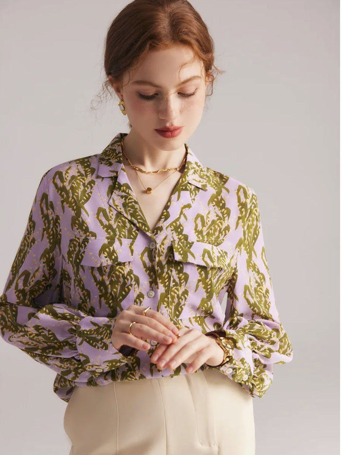 Women's 100% Mulberry silk crepe de chine shirt with pastel floral print, notched collar, and flap pockets. From Borcelleclothes.