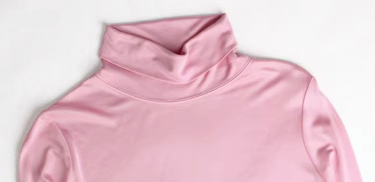 Detailed stitching and textured fabric on the collar of  Women's Silk High-Neck Top in Vanilla Ice, crafted from 100% Mulberry Silk for an elegant foundation to showcase jewelry. From Borcelleclothes.