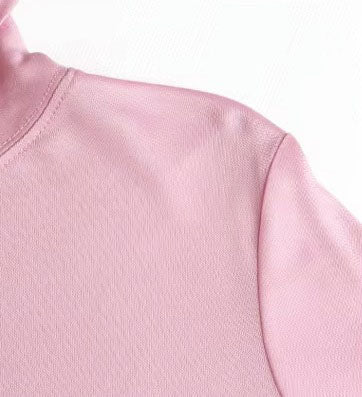 Detailed stitching and textured fabric on the shoulder of  Women's Silk High-Neck Top in Vanilla Ice, crafted from 100% Mulberry Silk for an elegant foundation to showcase jewelry. From Borcelleclothes.