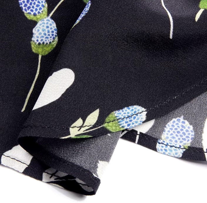 Detailed stitching and textured fabric on the wrong side of the bottom of a women's silk shirt with berry-inspired print. From Borcelleclothes.