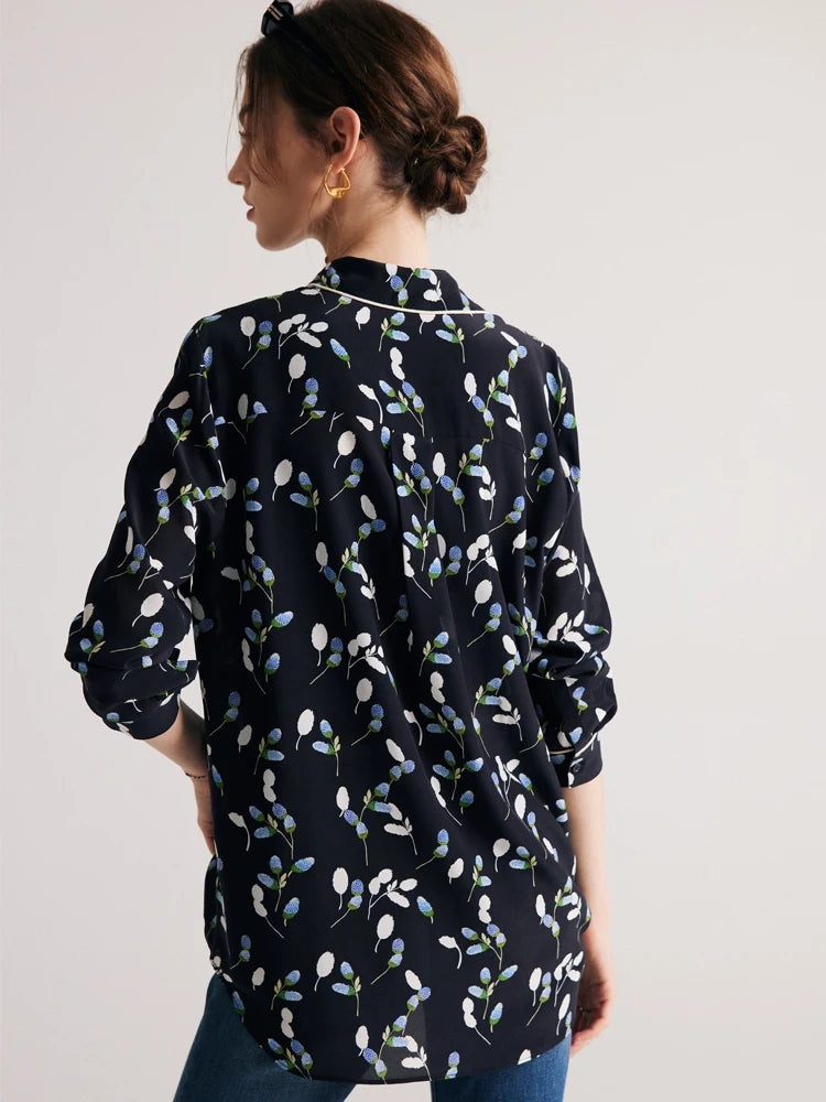 The back of the women's silk shirt with berry-inspired print, highlighting the smooth drape and modern fit. From Borcelleclothes.