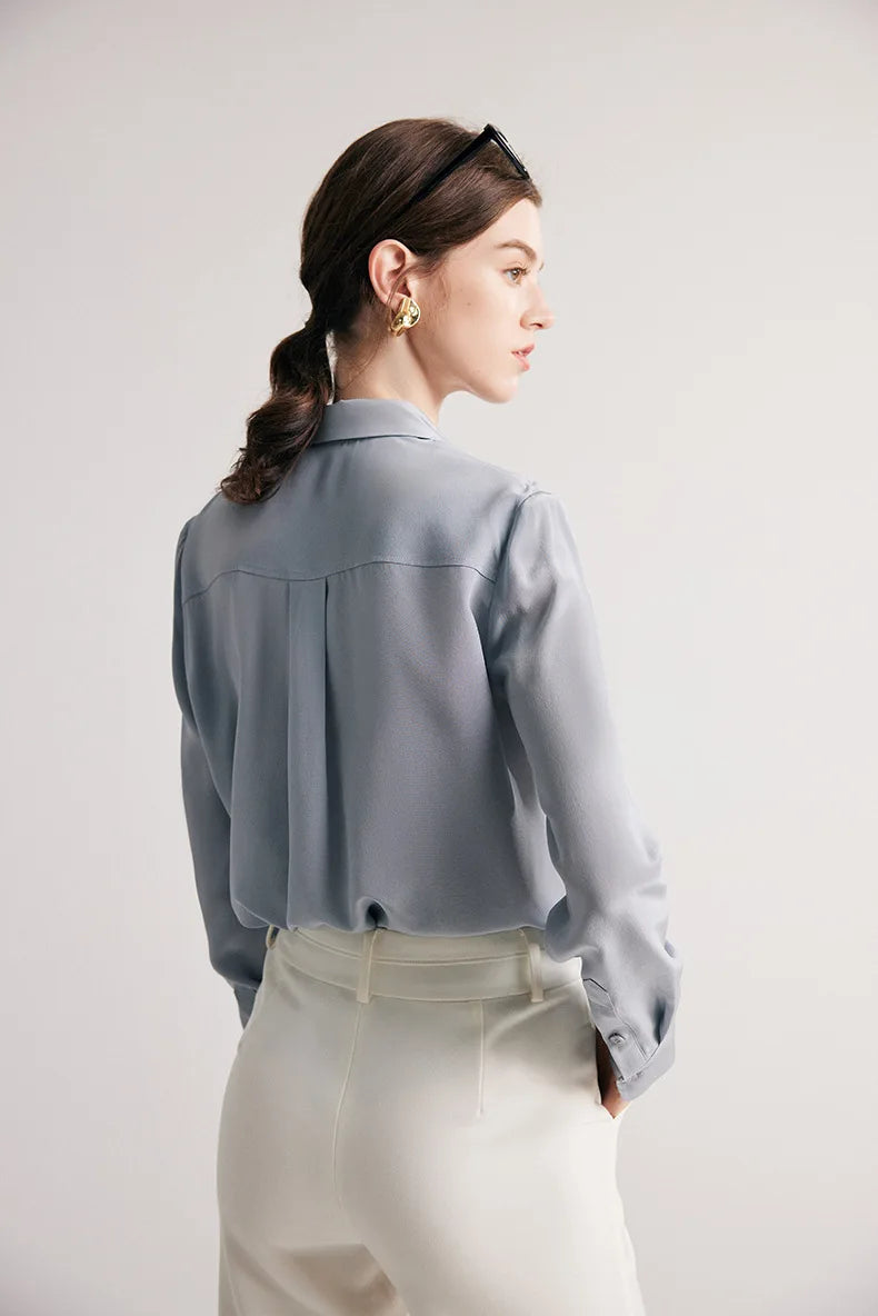 Back view of model wearing silk shirt in Lavender Grey. From Borcelleclothes.