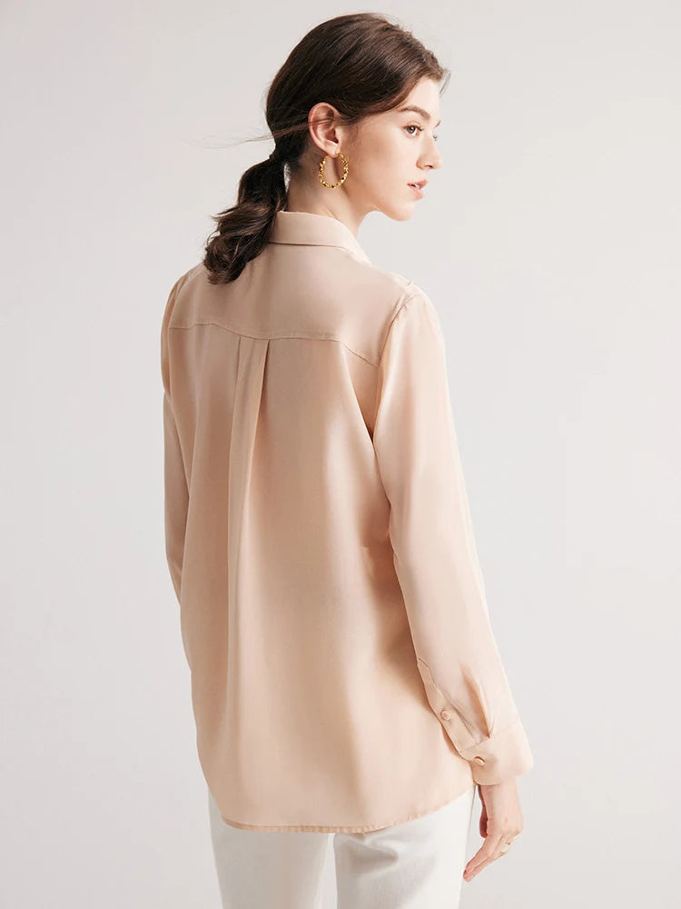 Back view of model wearing Misty Rose silk shirt. From Borcelleclothes.