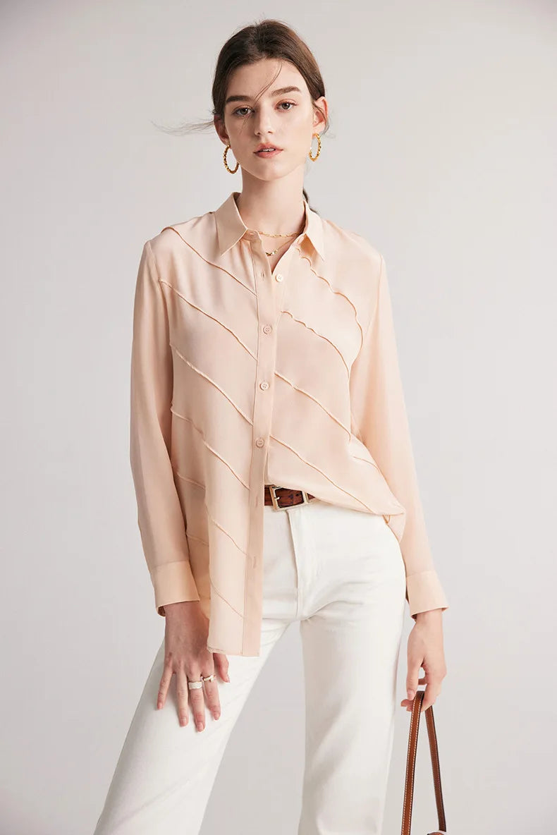 Model wearing Misty Rose silk shirt with one side untucked at the front. From Borcelleclothes.