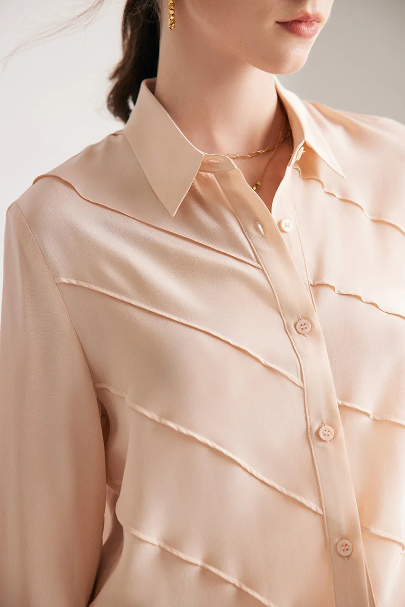 Model wearing Misty Rose silk shirt, upper part with diagonal folds. From Borcelleclothes.