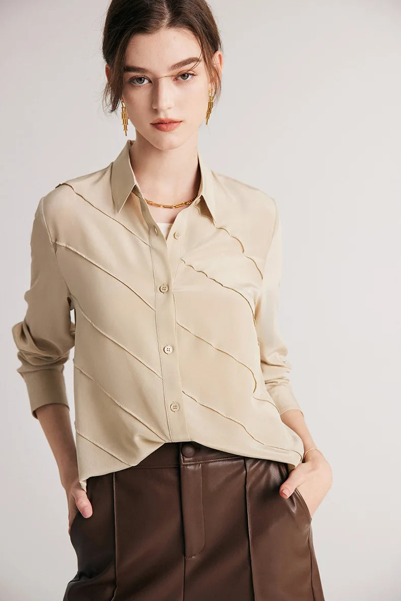 Model looking straight ahead in silk shirt in Soft Amber. From Borcelleclothes.