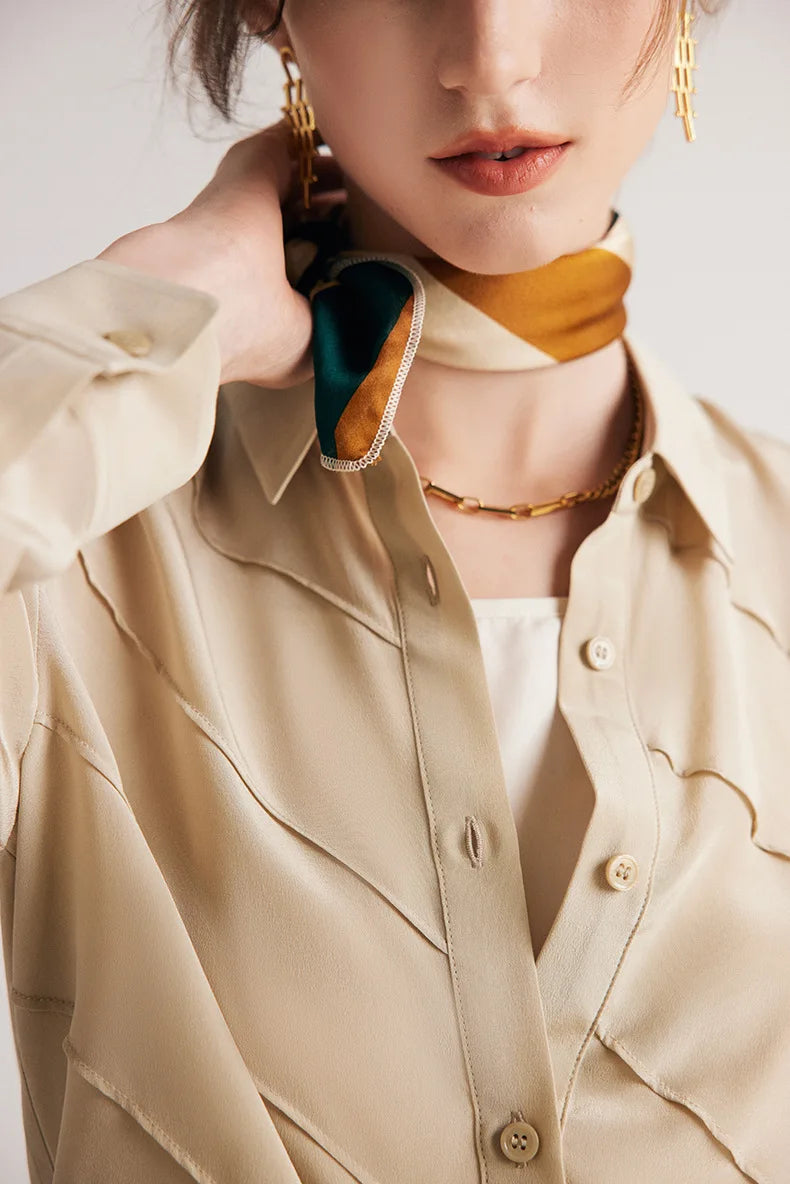 Soft Amber silk shirt styled with a scarf, upper part visible. From Borcelleclothes.