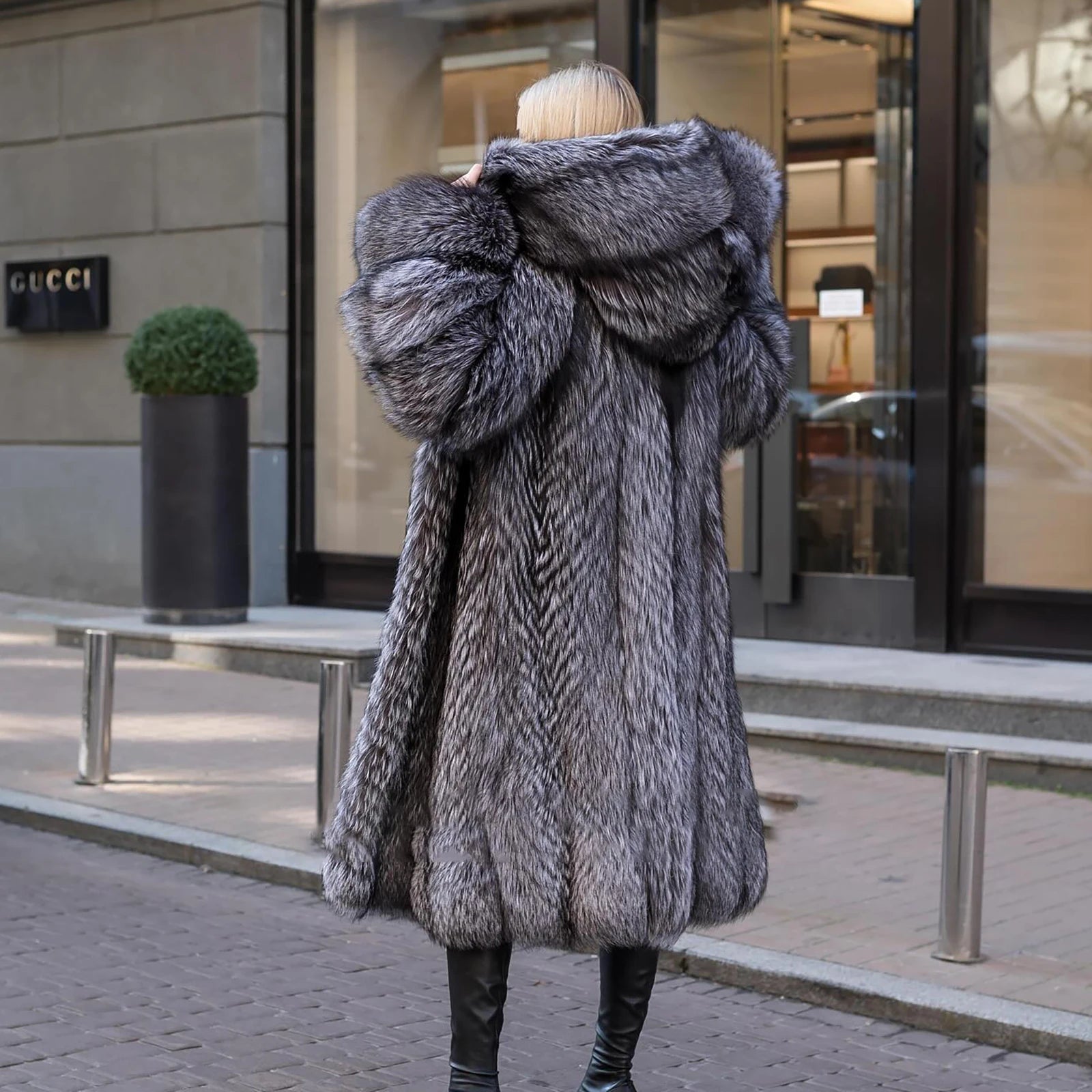 Rear view of a Women's Silver Fox Fur Coat, emphasizing its full-pelt construction, fluid drape, and mid-calf length. From Borcelleclothes.