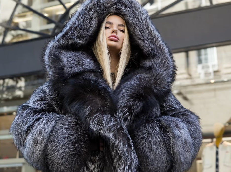 The upper part of a Women's Silver Fox Fur Coat, focusing on the hood’s luxurious volume and refined craftsmanship. From Borcelleclothes.