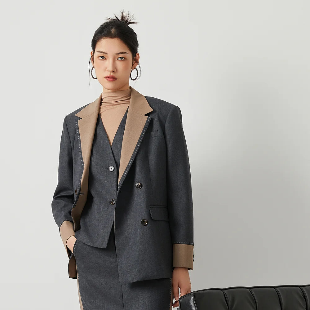 Women’s double-breasted blazer in Davy Grey with contrast lapels and decorative stitching. From Borcelleclothes.