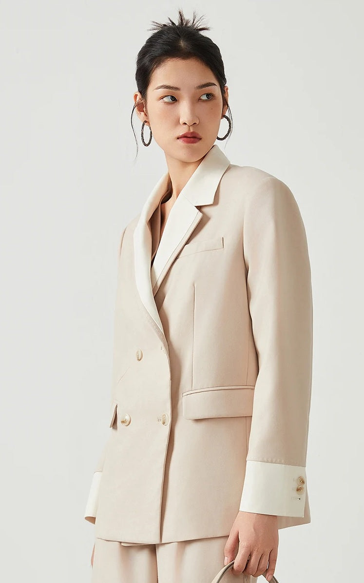 Model wearing women’s Silver Pink & Davy Grey blazer in Silver Pink, turned slightly to the side — From Borcelleclothes.