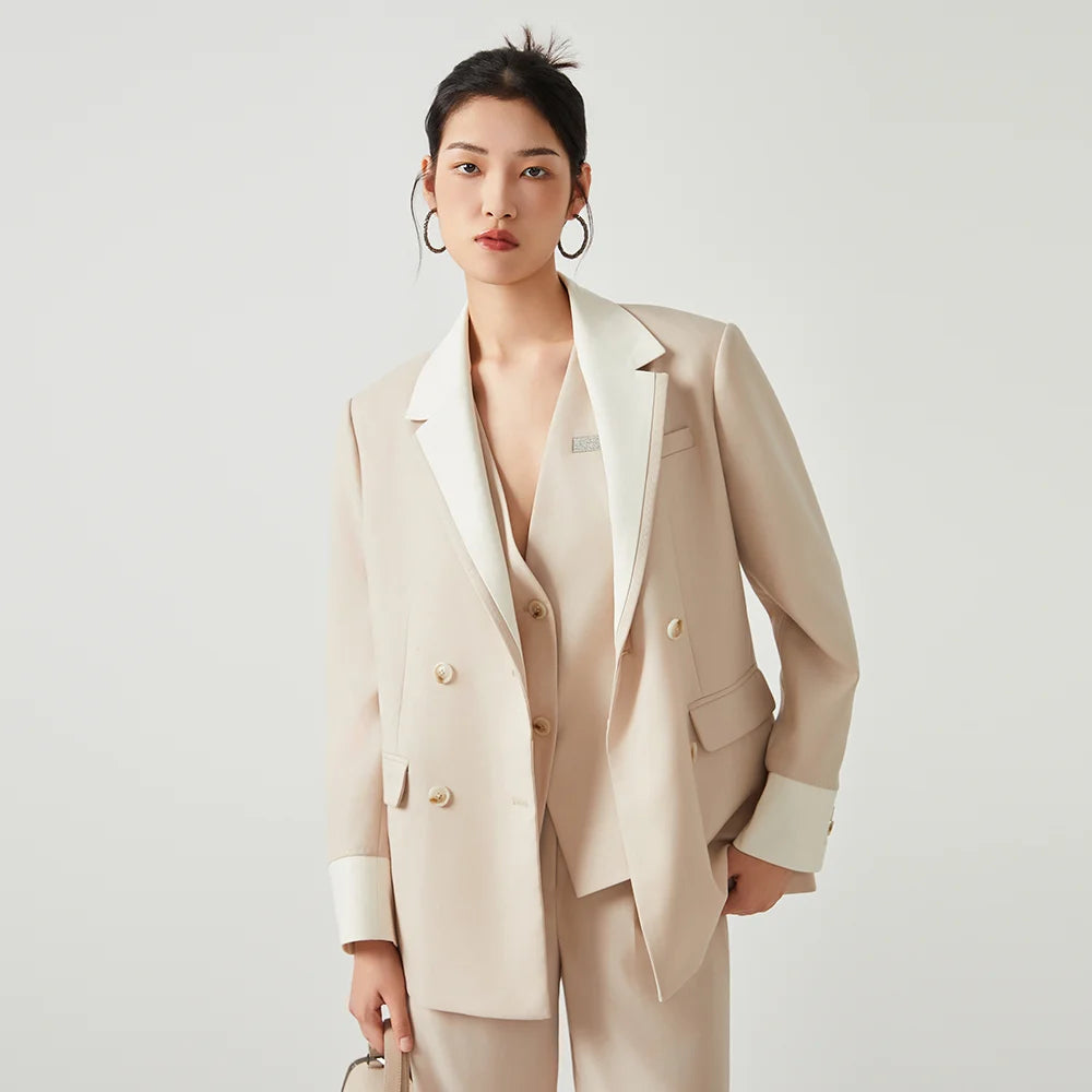 Women’s double-breasted blazer in Silver Pink with contrast lapels and decorative stitching. From Borcelleclothes.