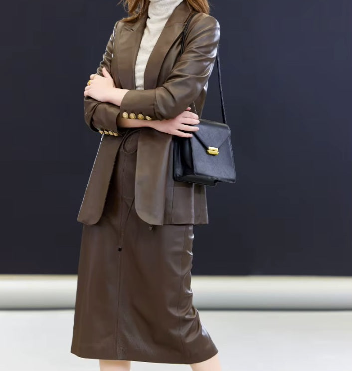 Model in Dark Rum leather blazer with arms crossed — a relaxed stance echoing the blazer’s ease and understated structure. From Borcelleclothes.