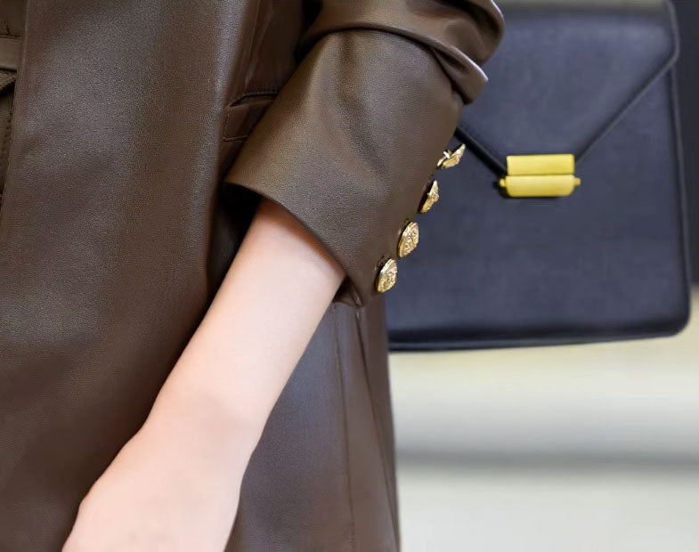 Sleeve placket of the Dark Rum blazer — four gold-toned buttons tracing the cuff like quiet punctuation. From Borcelleclothes.