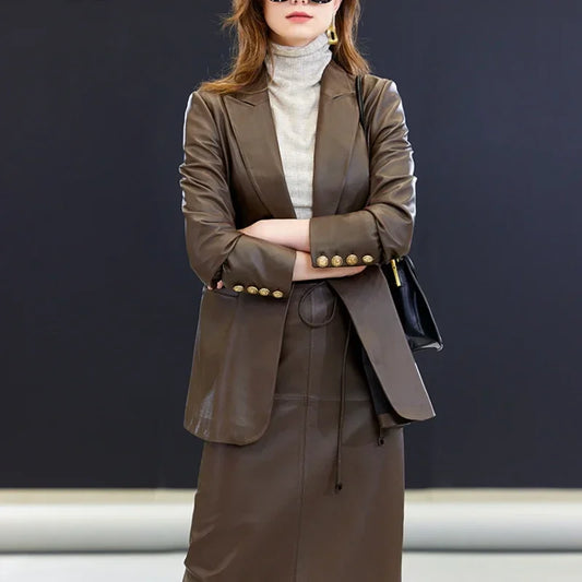 Women’s single-breasted sheepskin leather blazer — a softly structured silhouette with peaked lapels, a single ornate button, and quiet gold-toned accents, crafted for movement and presence without insistence. From Borcelleclothes.