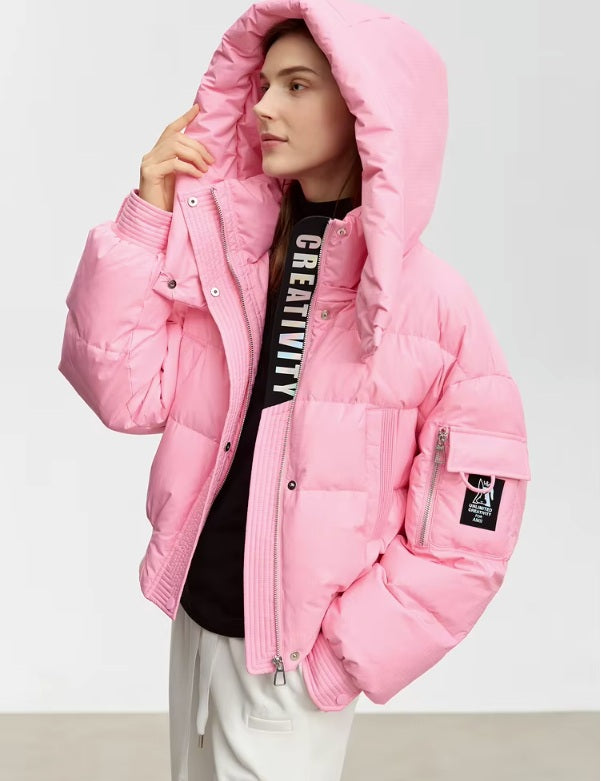 Model wearing the Cherry Blossom sleek down jacket with lifted hood. From Borcelleclothes.