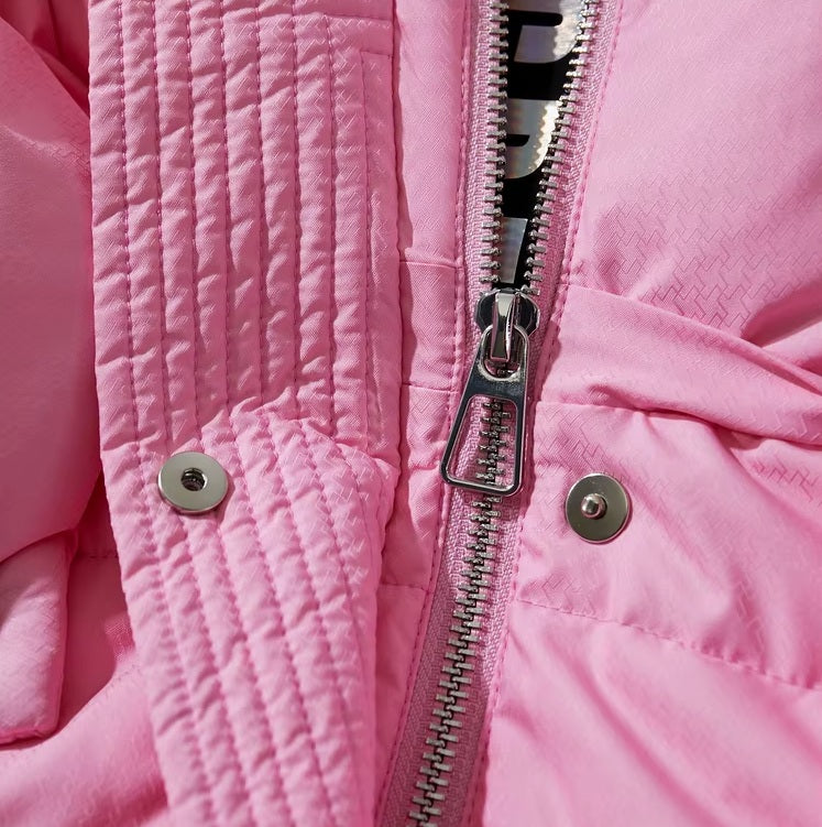 Zipper puller detail on the Cherry Blossom sleek down jacket. From Borcelleclothes.