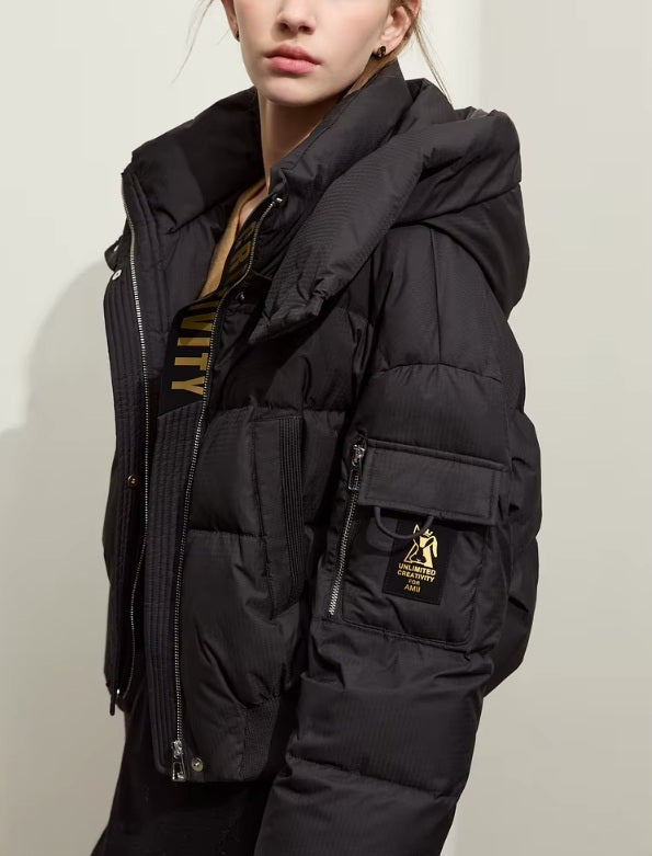 Left-side view of the Onyx sleek down jacket showing sleeve pocket with creative detail. From Borcelleclothes.