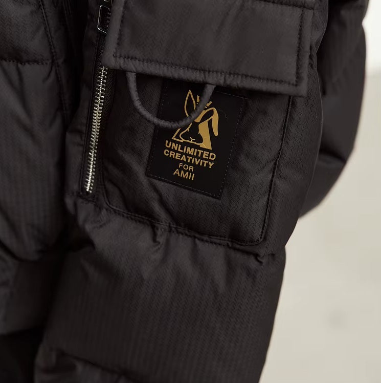 Utility pocket with printed creative detail on the left sleeve of the Onyx sleek down jacket. From Borcelleclothes.