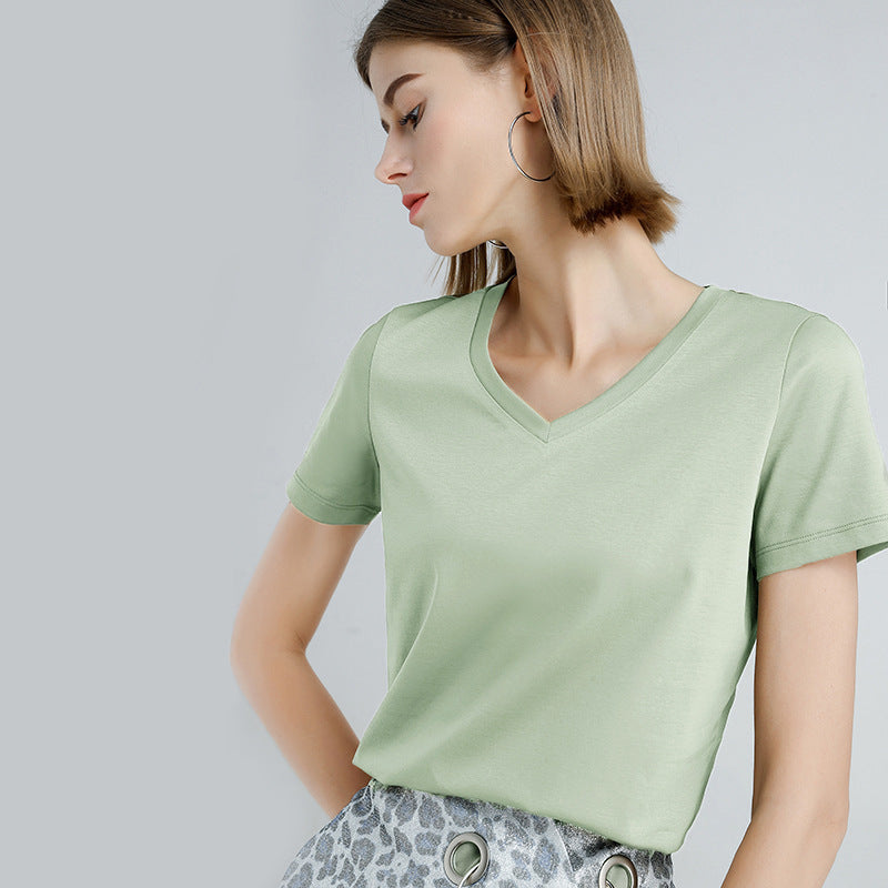 Women's Slim Fit Mercerized Cotton V-Neck T-Shirt in Pale Leaf– Expertly crafted from 100% mercerized cotton, featuring a luxuriously soft and smooth finish. This slim fit T-shirt with a modern V-neck design and sleek, solid pattern is perfect for versatile wear, offering both comfort and a timeless silhouette for any occasion. From Borcelleclothes.
