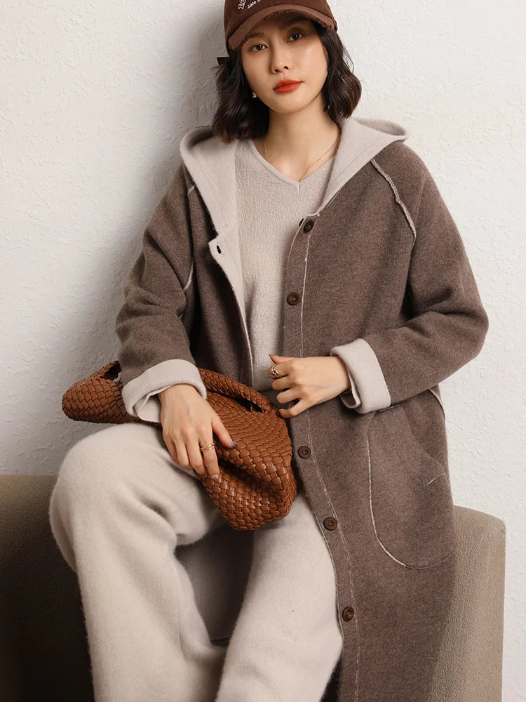 Model sitting on sofa in Champagne Pink straight-cut cashmere trousers — From Borcelleclothes.