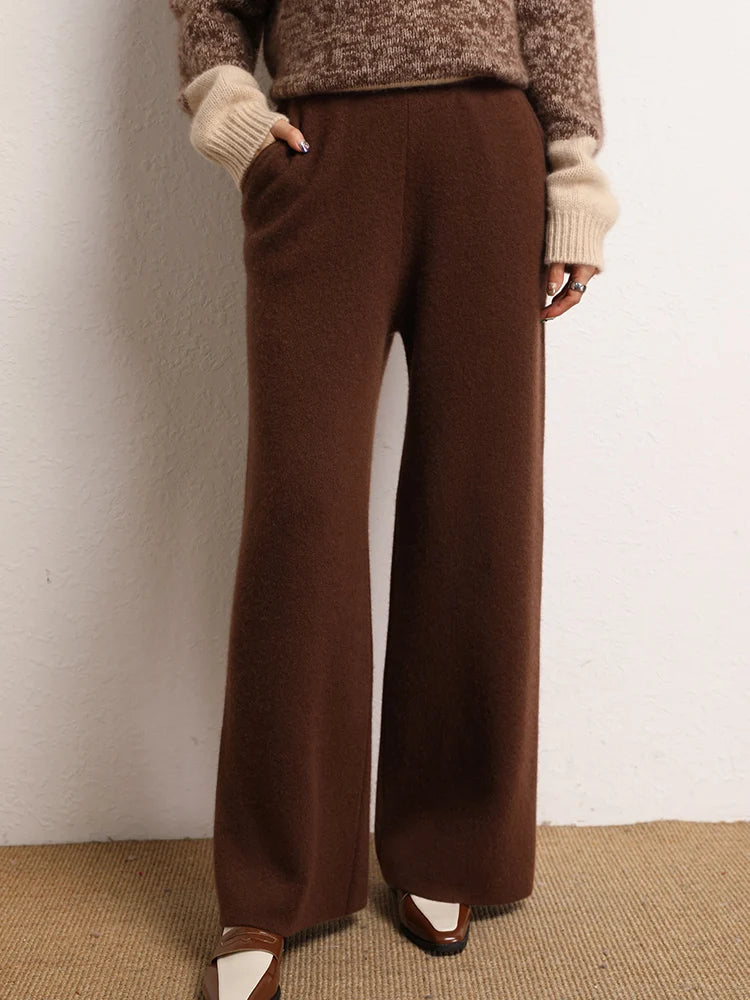 Women's Straight Cut Alashan cashmere trousers in Dark Sienna, featuring a straight cut, front slash pockets, and a ribbed waistband — From Borcelleclothes.