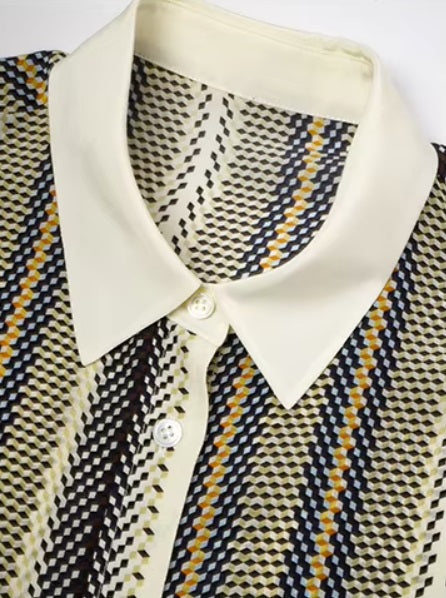 Detailed stitching and textured fabric on the collar of a striped 3D geometric silk shirt with orange, deep blue, and soft yellow stripes, featuring a cream collar and matching cuffs. From Borcelleclothes.