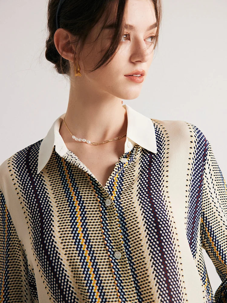 Model wearing a striped 3D geometric silk shirt with orange, deep blue, and soft yellow stripes, featuring a cream collar and matching cuffs. From Borcelleclothes.