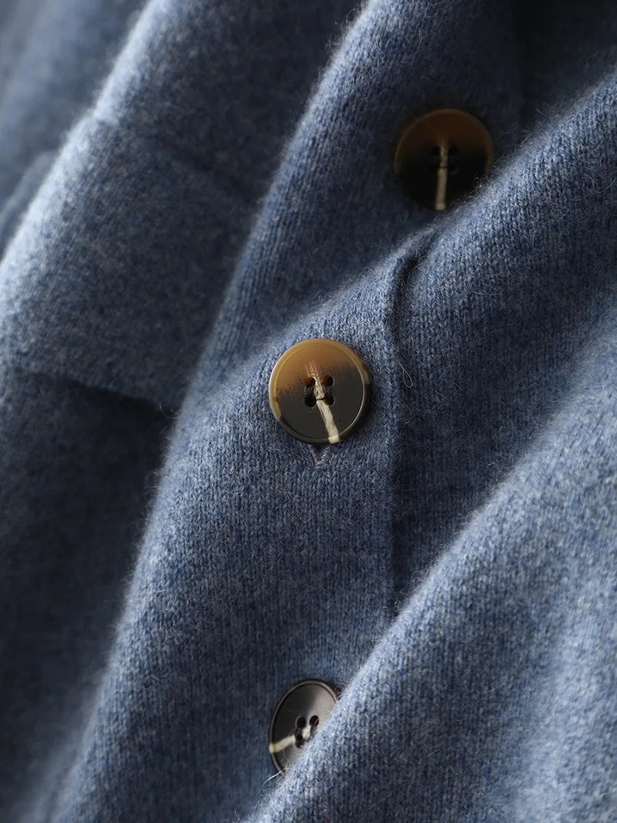 Side slit of Frosted Blueberry cashmere cardigan fastened with buttons, showing architectural vent construction — From Borcelleclothes.