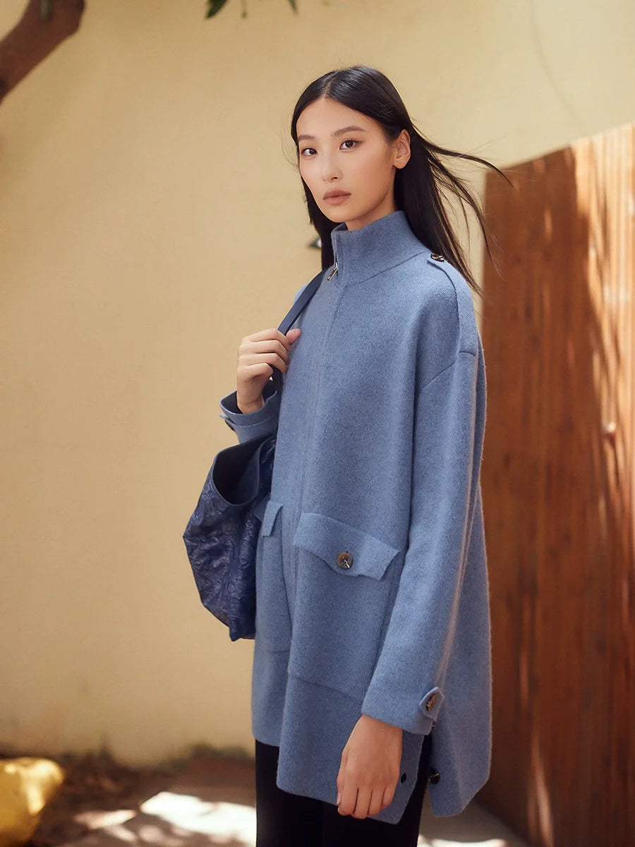 Side view of structured cashmere cardigan in Frosted Blueberry, showing defined shoulder line and architectural silhouette — From Borcelleclothes.