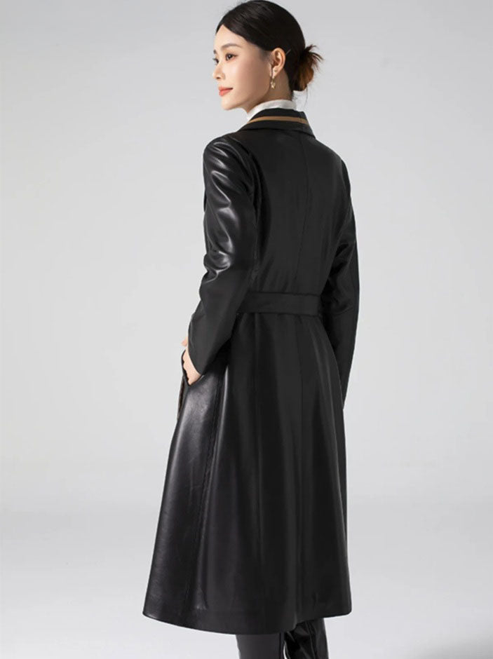 Women's Structured Leather Coat in Onyx with Warm Ochre Trim. Full back view displaying precise seam placement and fluid yet structured movement. Borcelleclothes.