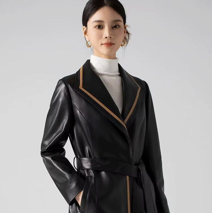 Women's Structured Leather Coat in Onyx with Warm Ochre Trim. Close-up of the upper section, featuring a sculpted lapel collar and structured silhouette. Borcelleclothes.