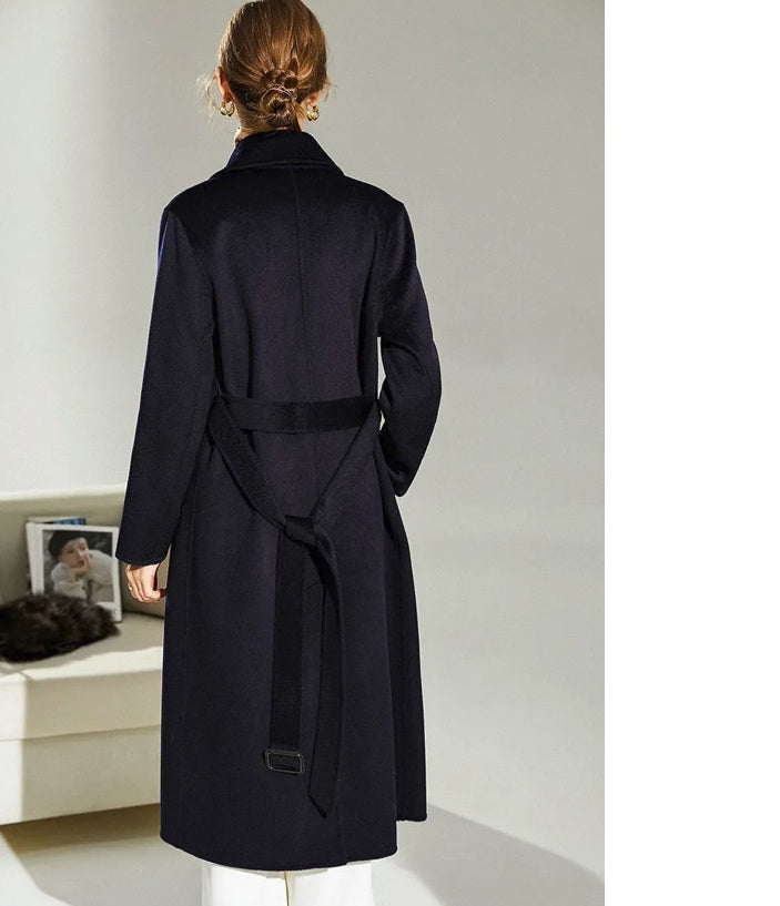 Back view of the Mirage structured wool coat worn by model, displaying structure and vent. From Borcelleclothes.