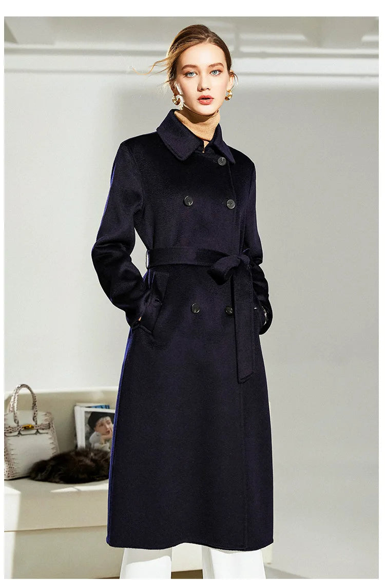 Model turned slightly to the side in Mirage structured wool coat, showing fit and posture. From Borcelleclothes.