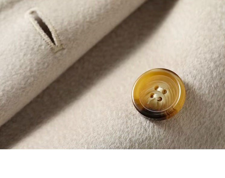 Close-up of the horn button on the Pearl Bush structured wool coat. From Borcelleclothes.