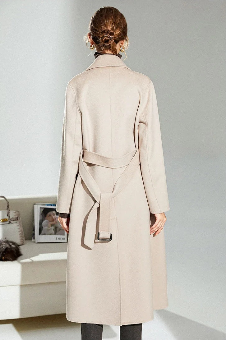Back view of the Pearl Bush structured wool coat worn by model, showcasing center vent and tailored structure. From Borcelleclothes.