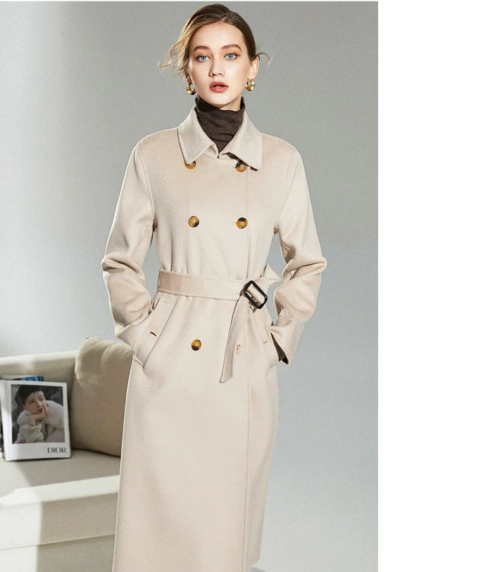 Model in Pearl Bush structured wool coat with hands in pockets, highlighting clean silhouette. From Borcelleclothes.